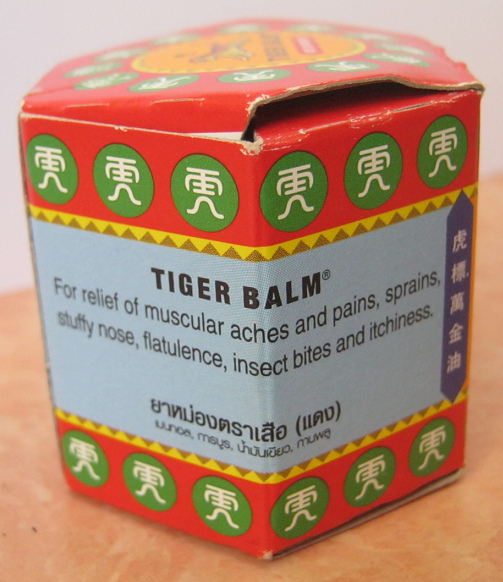 The box of tiger balm indicating the
                      applications and healings