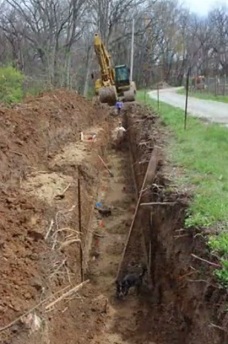 Excavator work 02 the trench, the raised bed
              remains