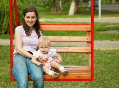 Mother with a child 02 on
                          a swing, stockfoto