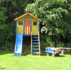 Colorful garden house with slide,
                            residence Banjaard at North Sea in Holland
