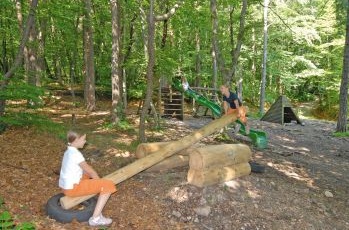 Seesaw 07 with
                              horizontally placed tire buffers on a wood
                              playground in Eppan in Austria