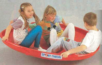 Gonge round seesaw 04
                            with 3 children in it, Sport Thieme GmbH,
                            Grasleben, Germany