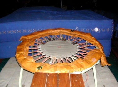 Trampoline
                            1: Old trampoline with open visible spiral
                            springs, in Nepal