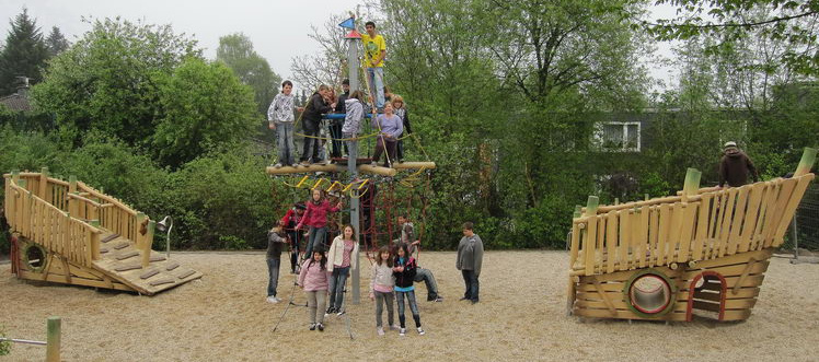 There is a ship half sank on the
                                playground of Lower Secondary School of
                                Much, North Rhine Westfalia, Germany