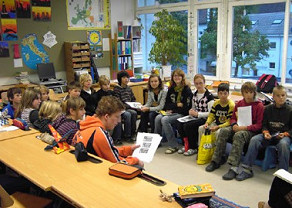 School
                  class presenting a group result